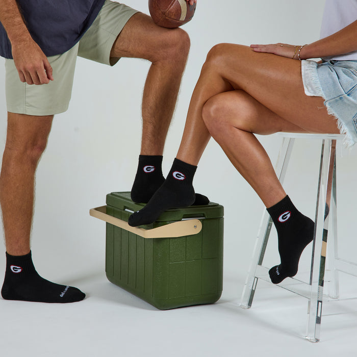 Two models wearing Del Campo Georgia Night Mode golf socks in studio