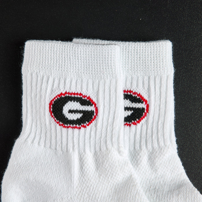 Close-up of the black G in a red oval on Del Campo Georgia Pack golf socks