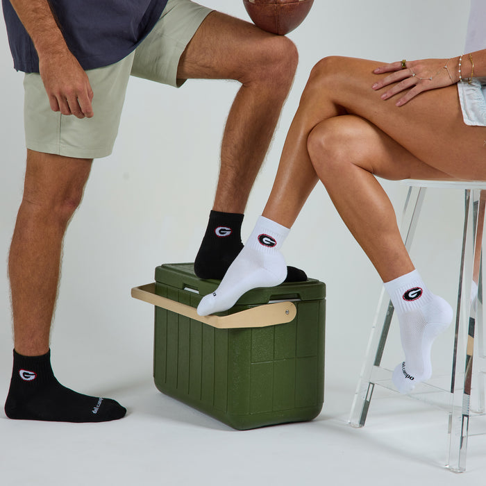 Two models wearing Del Campo Georgia Pack golf socks in studio