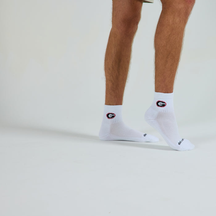 Man wearing Del Campo Georgia Bulldogs golf socks, studio shot, no shoes