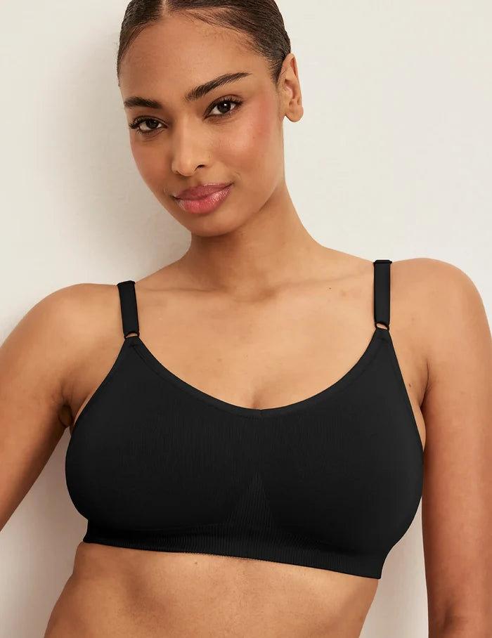 | Front view of model wearing the Good to Go Seamless Bra, highlighting the neckline, strap design, and  silhouette | Black