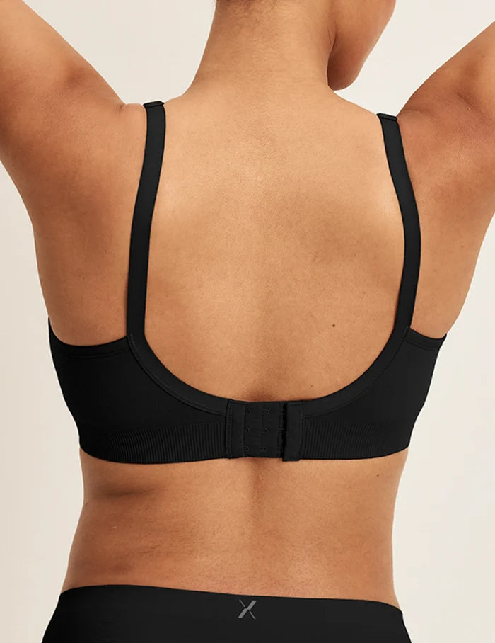 | Back view of model wearing the Good to Go Seamless Bra, highlighting the neckline, strap design, and  silhouette | Black