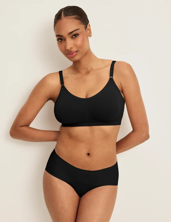 | Front view of model wearing the Good to Go Seamless Bra, highlighting the neckline, strap design, and  silhouette | Black