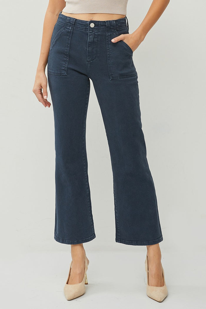 navy blue patch pocket flare ankle high rise pants  worn with heels and a tank top