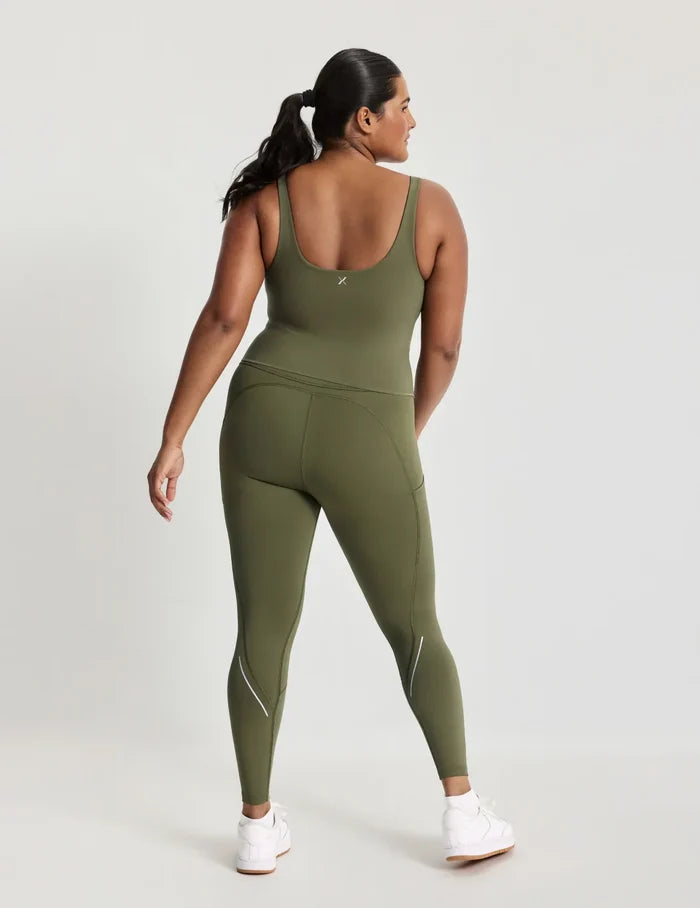 Adiya is a 36C and wears a Knix size L | Back view of model wearing the HiTouch™️ Active Contour Tank, highlighting the neckline, strap design, and silhouette | Olive
