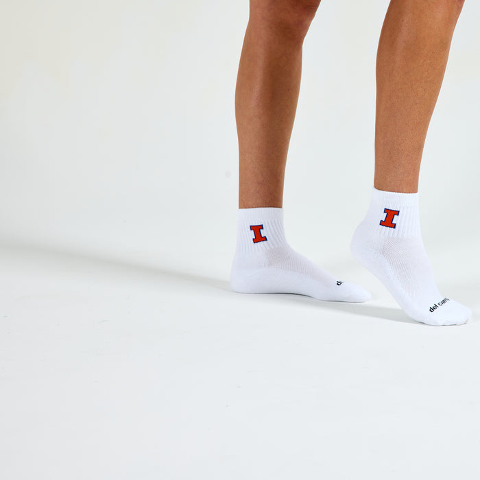 Woman wearing Del Campo Illinois Fighting Illini golf socks, studio shot, no shoes