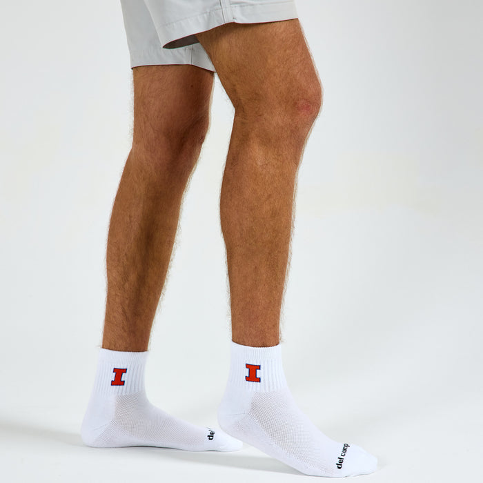 Man wearing Del Campo Illinois Fighting Illini golf socks, studio shot, no shoes