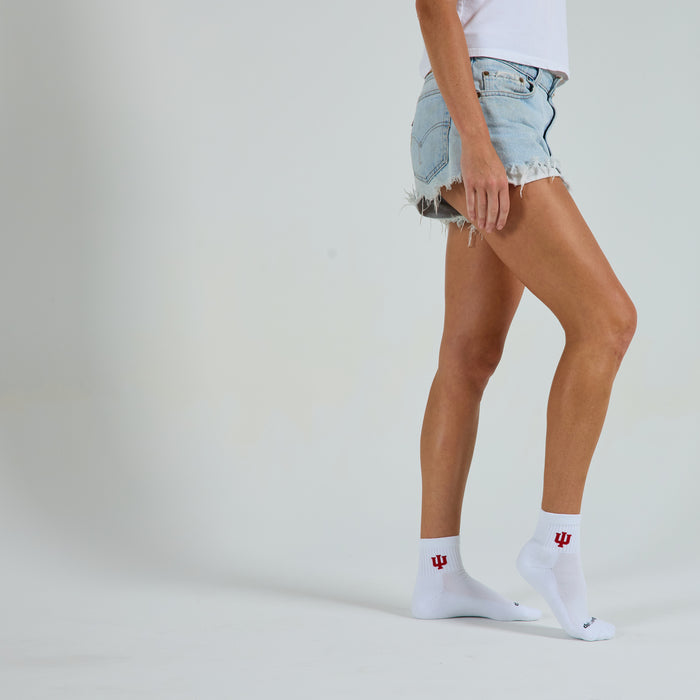 Woman wearing Del Campo Indiana Hoosiers golf socks, studio shot, no shoes