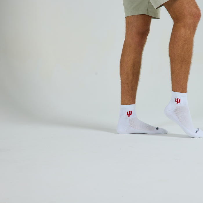 Male model in Del Campo Indiana Hoosiers golf socks, studio backdrop
