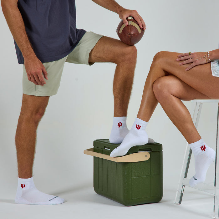 Two models wearing Del Campo Indiana Hoosiers golf socks in studio