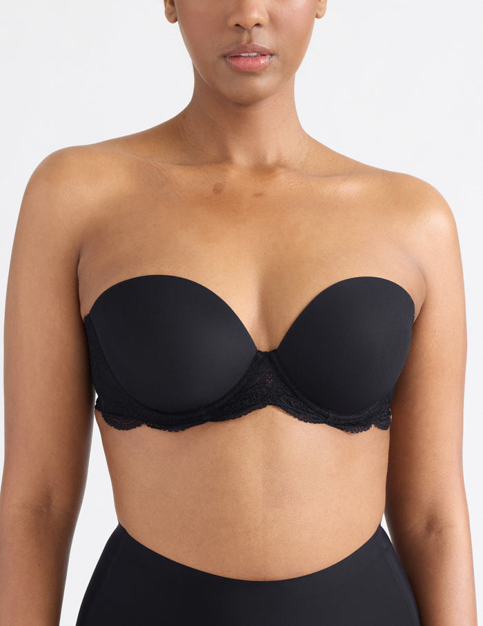 | View of model wearing the Karma Strapless Bra, highlighting the neckline, support level, and strapless design | Black