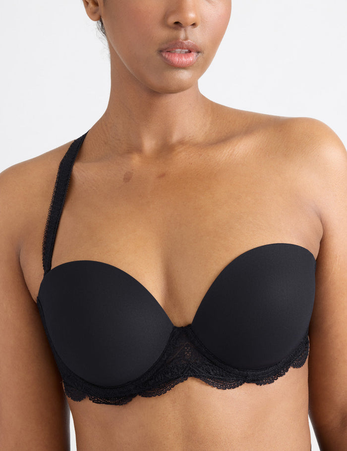 | View of model wearing the Karma Strapless Bra, highlighting the neckline, support level, and strapless design | Black