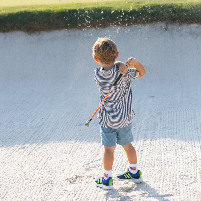 Del Campo Kids Pack golf socks featuring four kids' designs: smiley, blue smiley, pink smiley, and 1776
