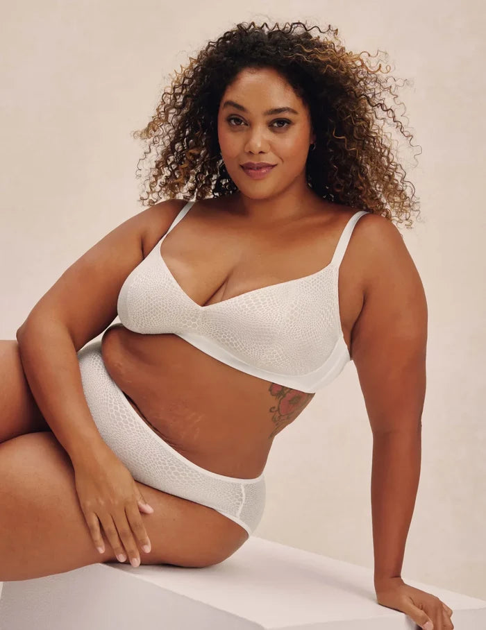 | Front view of model wearing the Lace Bra, highlighting the neckline, strap design, and  silhouette | White