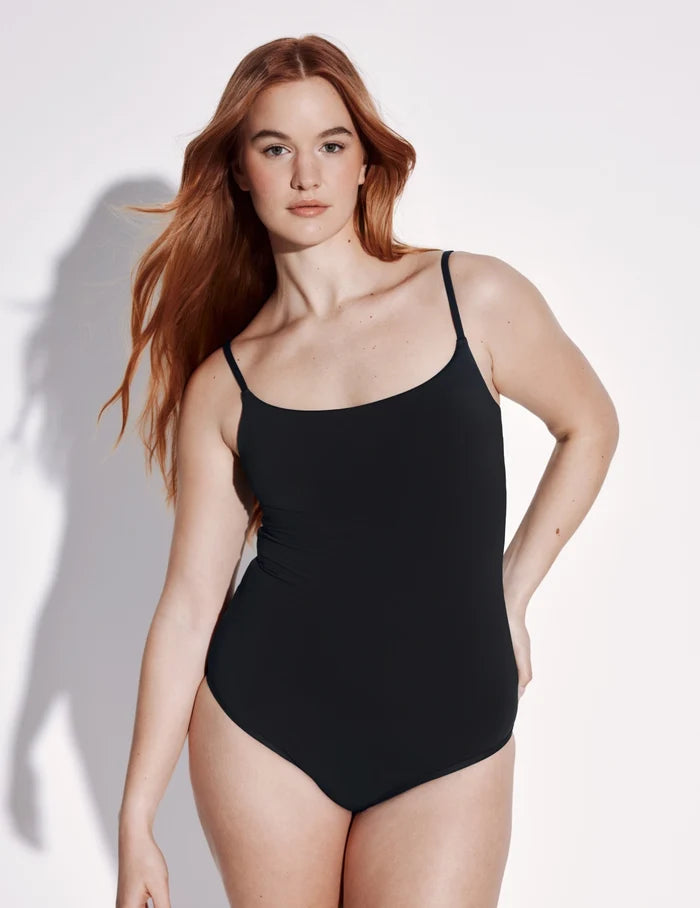 | Front view of model wearing the Leakproof Classic One Piece Swimsuit highlighting the neckline, coverage and fit | Black