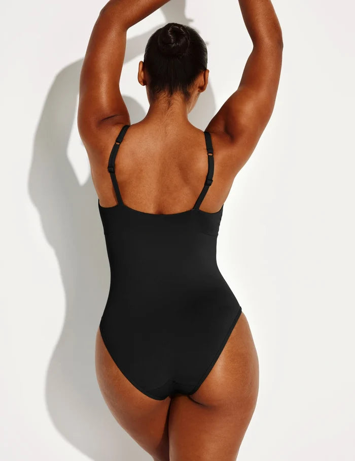 | Back view of model wearing the Leakproof Sculpt Deep V One Piece Swimsuit highlighting the neckline, coverage and fit | Black
