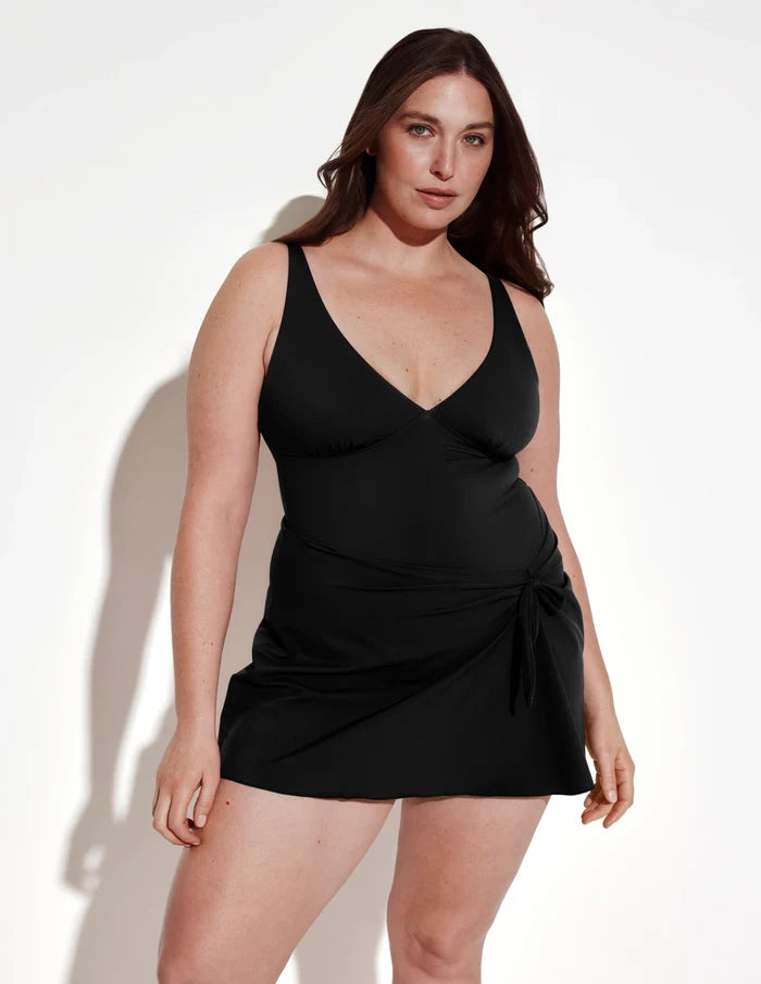 | Front view of model wearing the Leakproof Sculpt Deep V Swim Dress highlighting the coverage and fit | Black