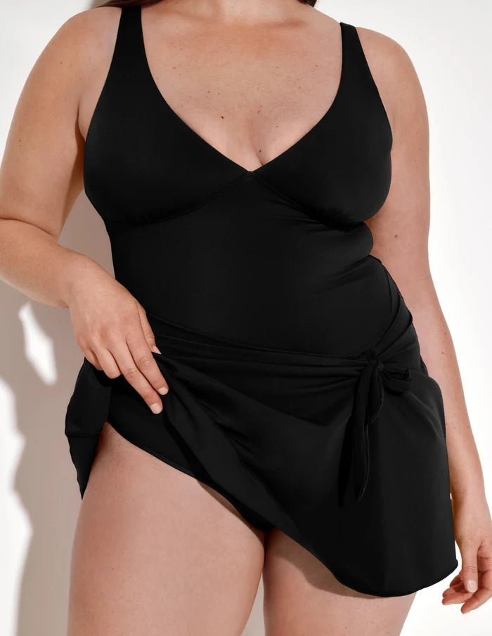 | Front view of model wearing the Leakproof Sculpt Deep V Swim Dress highlighting the coverage and fit | Black
