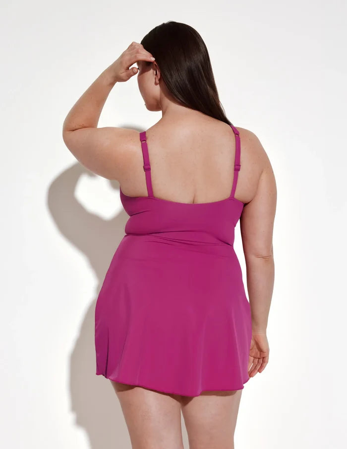 | Back view of model wearing the Leakproof Sculpt Deep V Swim Dress highlighting the coverage and fit | Deep Orchid