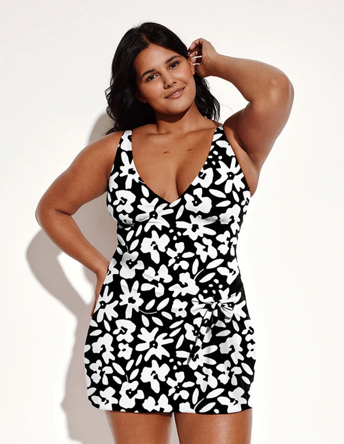 | Front view of model wearing the Leakproof Sculpt Deep V Swim Dress highlighting the coverage and fit | Jasmine Dusk