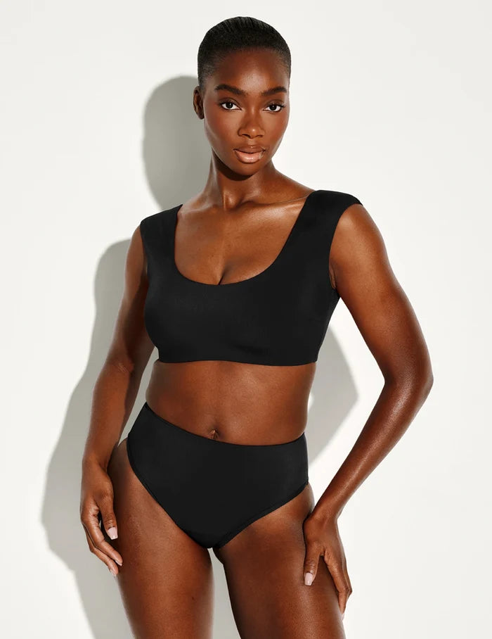 | Front view of model wearing the Leakproof Sculpt High Rise Bikini Swim Bottom highlighting the coverage and fit | Black