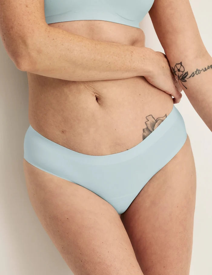 | Front view of model wearing the Light Leakproof No-Show Bikini 3-Pack highlighting the coverage and smooth fit | Twilight Navy/Blue Light/White