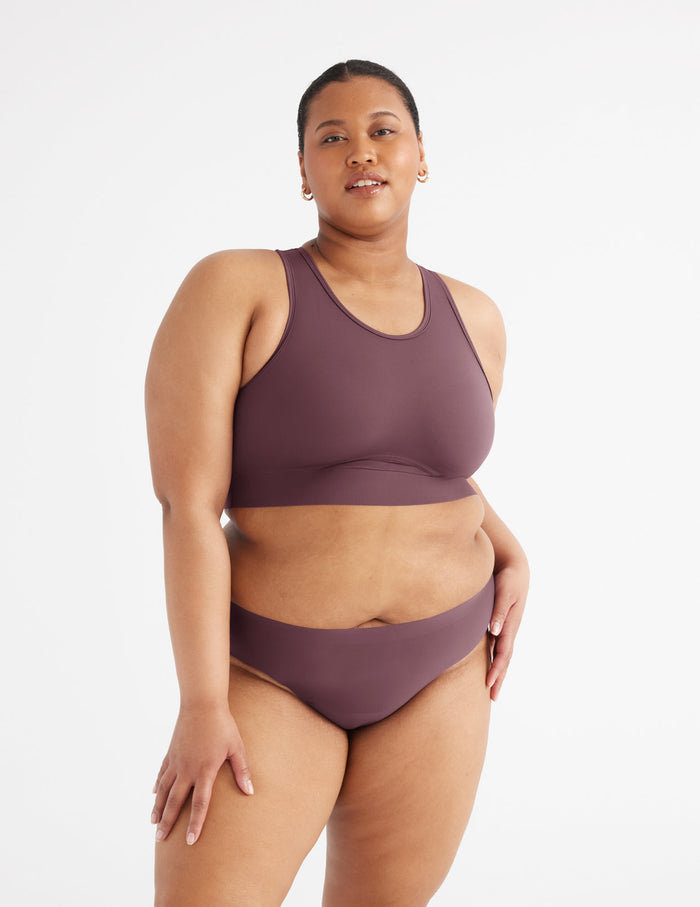 Analysa has 46.5”" hips and wears a Knix size XXL | Front view of model wearing the Light Leakproof No-Show Bikini highlighting the coverage and smooth fit | Dahlia