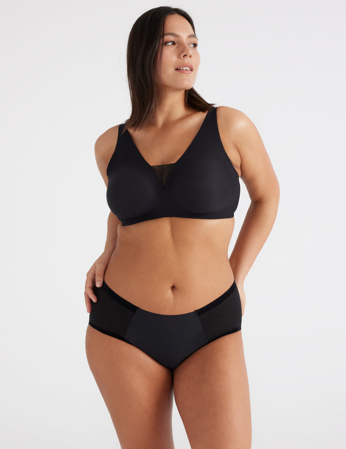 | Front view of model highlighting the coverage and fit | Black