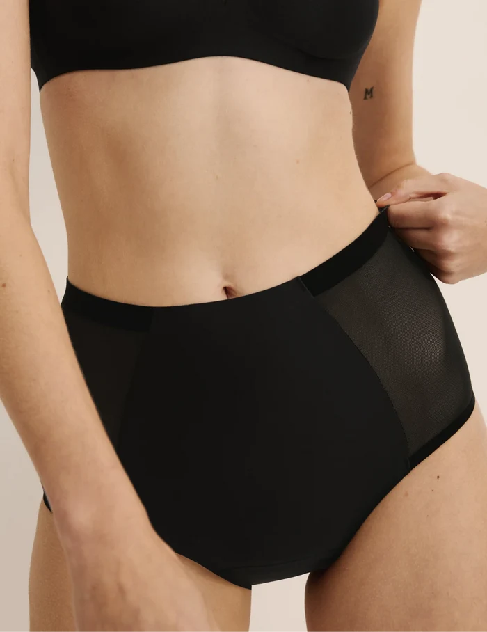 Molly has 35.5” hips, and wearing KNIX S | Black