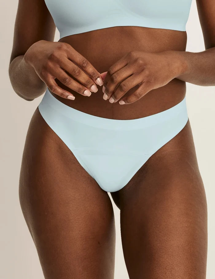 | Front view of model wearing the Light Leakproof No-Show Thong 3-Pack highlighting the coverage and smooth fit | Twilight Navy/Blue Light/White