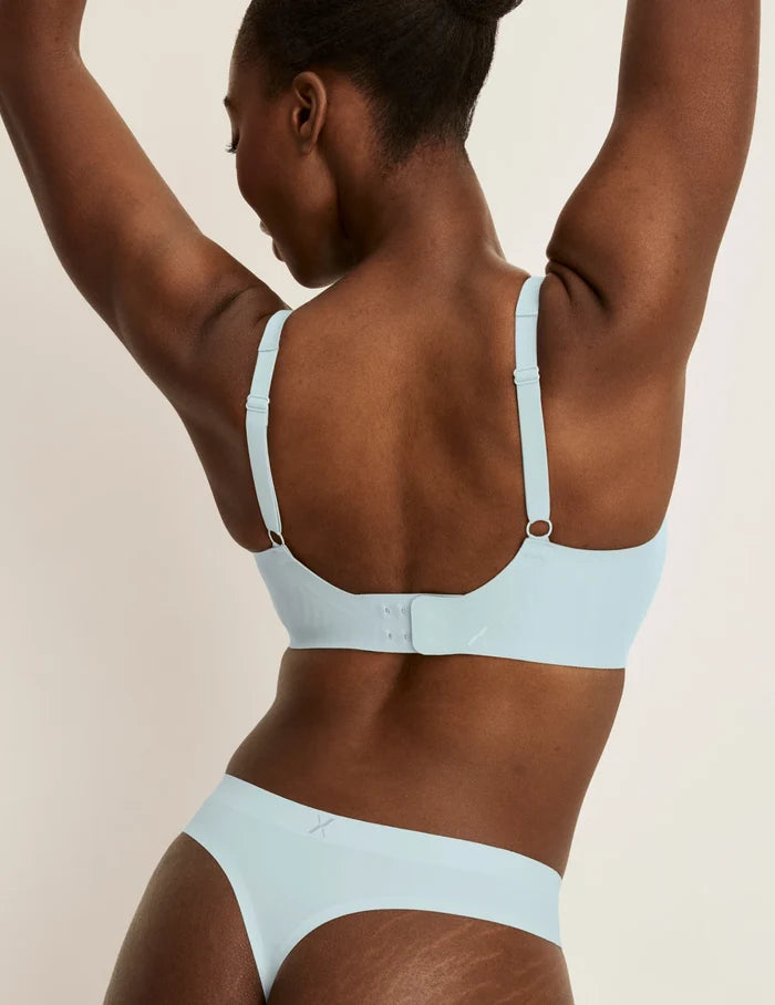 | Front view of model wearing the Light Leakproof No-Show Thong 3-Pack highlighting the coverage and smooth fit | Twilight Navy/Blue Light/White