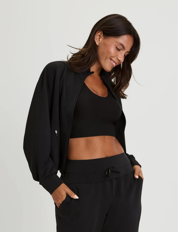 | Front view of model wearing the Longevity Sports Bra, highlighting the neckline, strap design, and silhouette | Black