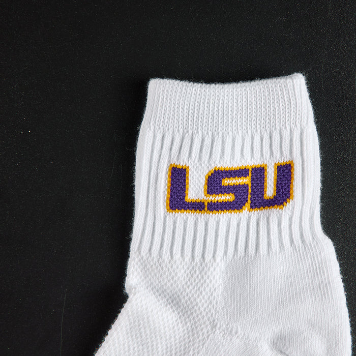 Close-up of the purple and gold LSU wordmark on Del Campo LSU Tigers golf socks