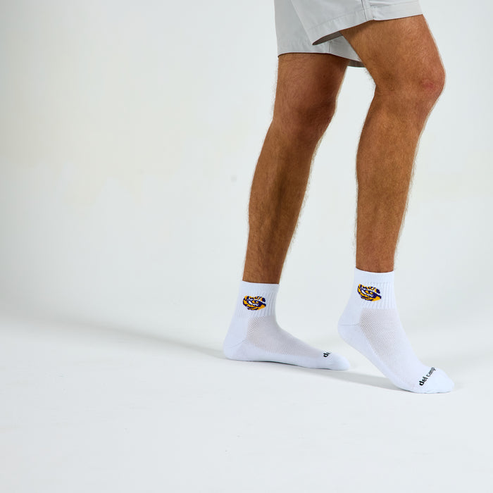 Man wearing Del Campo LSU Tigers golf socks, studio shot, no shoes