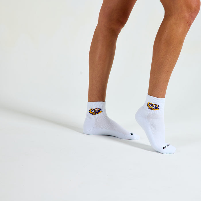 Woman wearing Del Campo LSU Tigers golf socks, studio shot, no shoes