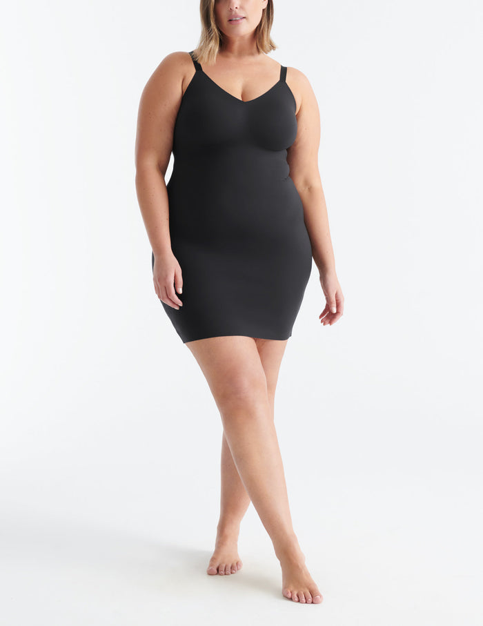 Gabrielle is a 38DD and has 45" hips and wears a Knix size XL | Front view of model wearing the LuxeLift Slip highlighting the neckline, strap design and fit | Black