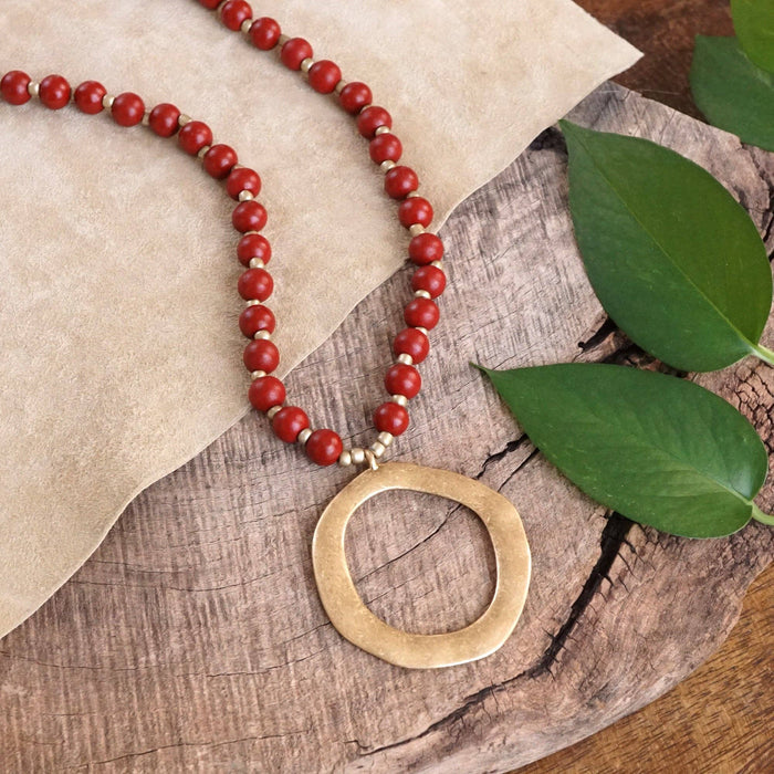 32-inch red wood bead necklace with gold color circle adorned
