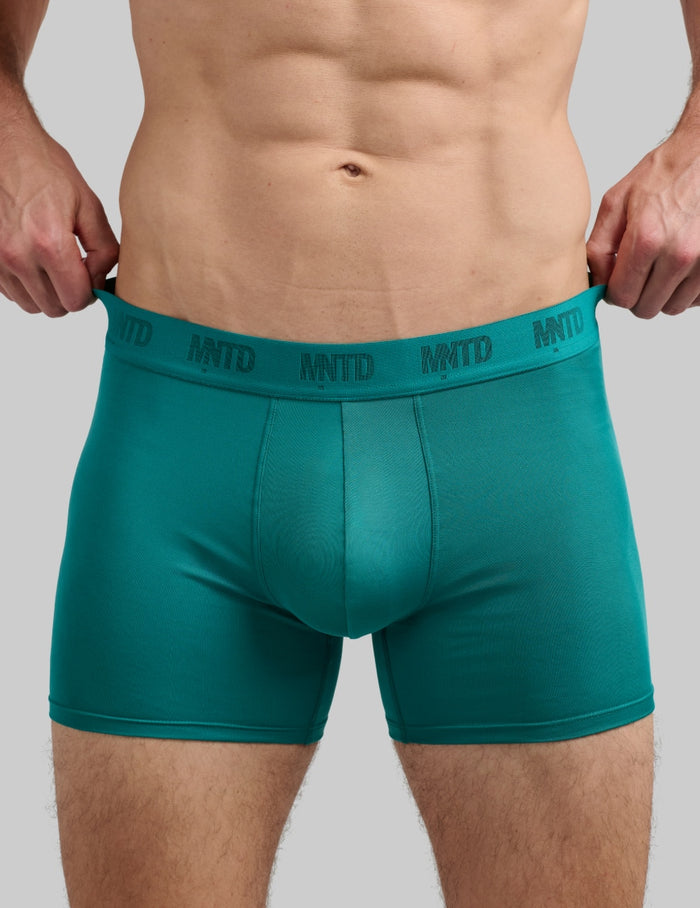 | Front view of model wearing the Men's ActivTemp™ Boxer Brief 5" highlighting the coverage and fit | Quetzal Green