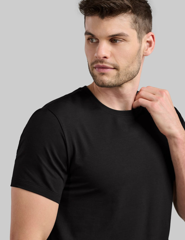 | Front view of model wearing the Men's Best Damn Tee highlighting the coverage and fit | Black