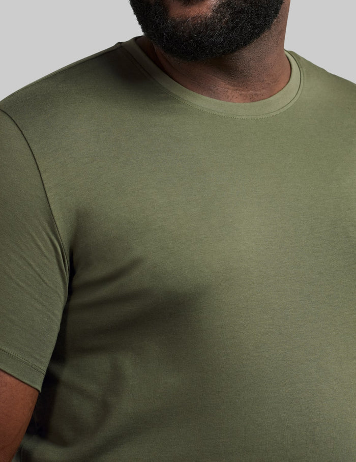 | Front view of model wearing the Men's Best Damn Tee highlighting the coverage and fit |  Moss
