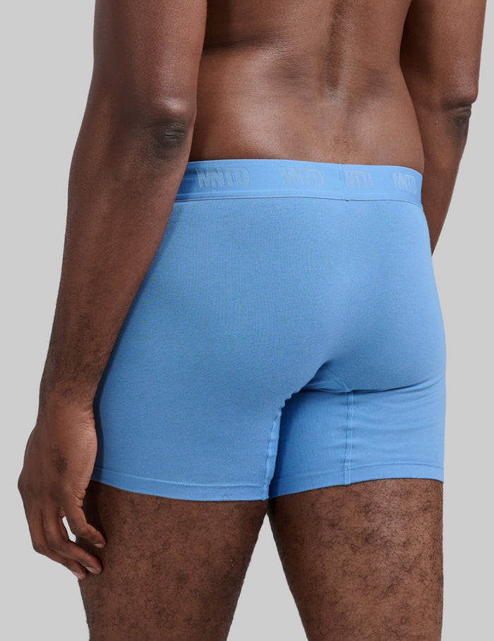 | Back view of model wearing the Men's Buffer Cotton Boxer Brief 5" highlighting the coverage and fit | Daylight