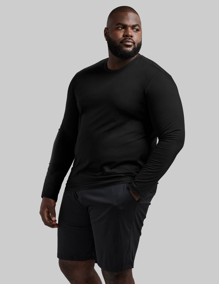 | Front view of model wearing the Men's CoolShift™ Long Sleeve highlighting the coverage and fit | Black
