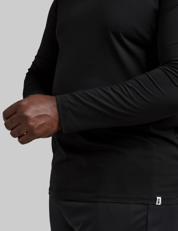 | Front view of model wearing the Men's CoolShift™ Long Sleeve highlighting the coverage and fit | Black