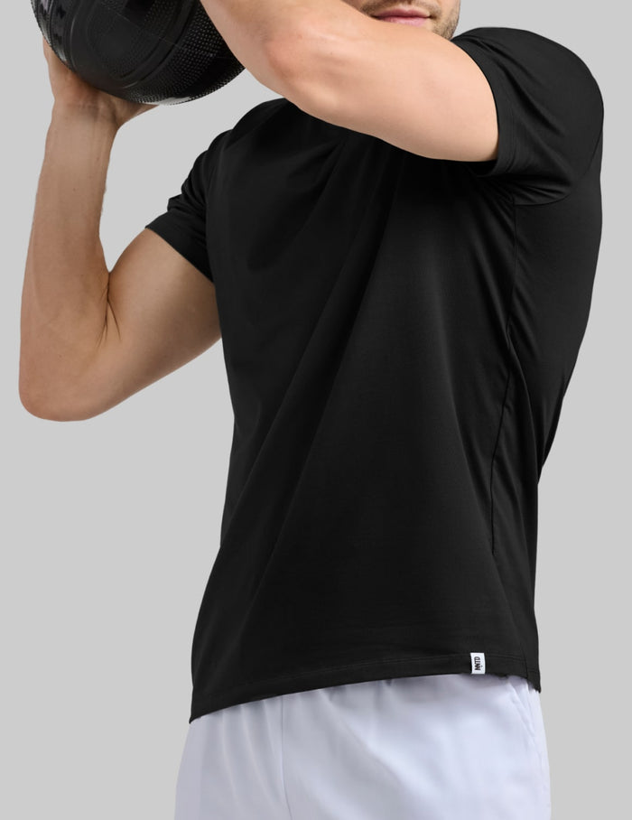 | Front view of model wearing the Men's CoolShift™ Tee highlighting the coverage and fit | Black