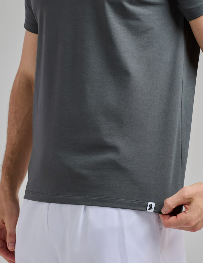 | Front view of model wearing the Men's CoolShift™ Tee highlighting the coverage and fit | Pewter