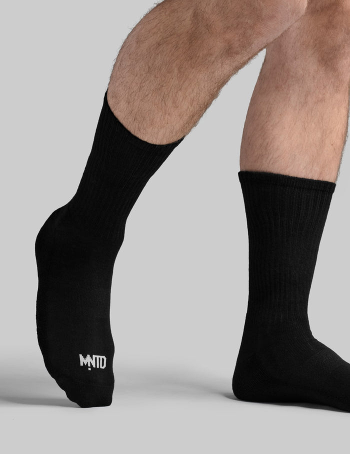 | View of model wearing the Men's Non-Stop Crew Socks | Black