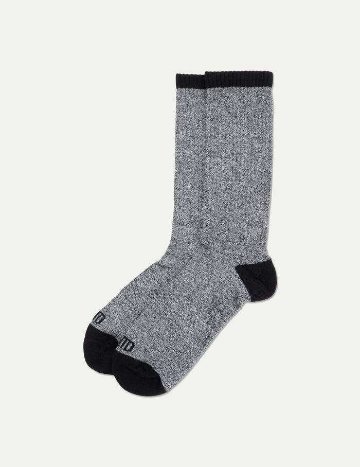 | Men's Non-Stop Crew Socks shown front-facing against a light gray background | Black/White