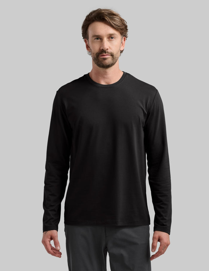 | Front view of model wearing the Men's Relaxed Fit Best Damn Long Sleeve highlighting the coverage and fit | Black