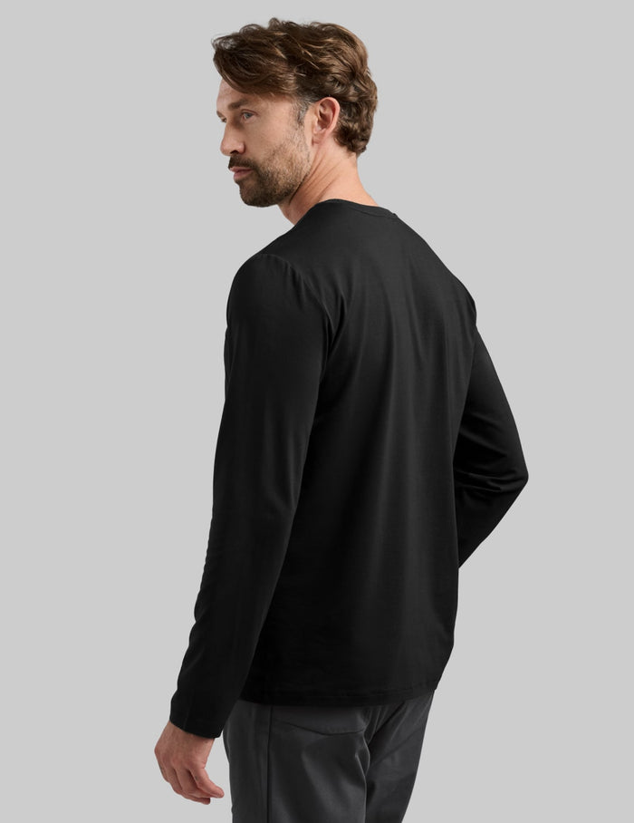 | Back view of model wearing the Men's Relaxed Fit Best Damn Long Sleeve highlighting the coverage and fit | Black
