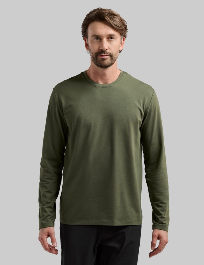 | Front view of model wearing the Men's Relaxed Fit Best Damn Long Sleeve highlighting the coverage and fit | Moss